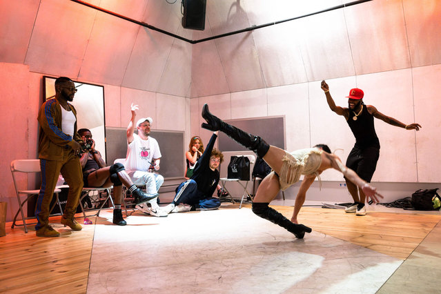 A dancer, and member of the House of Revlon, performs voguing during a rehearsal ahead of the “Stars of Paris are Shining Ball” at la Gaite Lyrique, in Paris, on June 14, 2023. “The Stars of Paris are Shining Ball” ballroom, a voguing event, will take place at La Gaite Lyrique, in Paris, on June 17, 2023. “Houses” will face each other in different categories such as “realness” or “performance”. (Photo by Julie Sebadelha/AFP Photo)