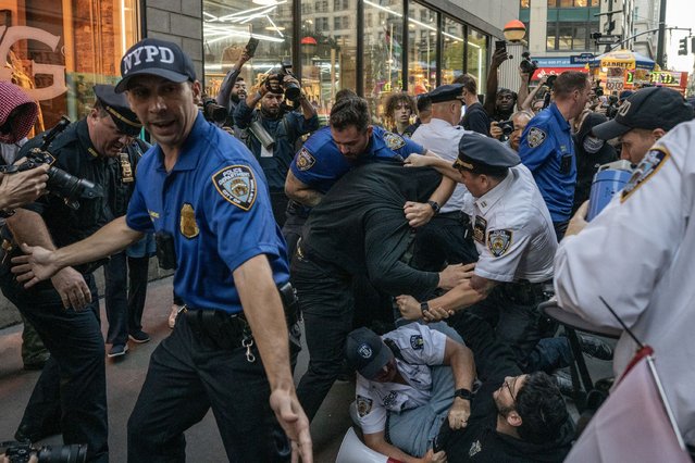 NYPD officers arrest a protester during a march against the war in Gaza on the anniversary of the Hamas attack on Israel  in New York, New York, on Monday, October 7, 2024. One year ago today Hamas breached the wall containing Gaza and attacked Israeli towns and military installations, killing around 1200 Israelis and taking 250 hostages, and sparking a war that has over the last year killed over 40,000 Palestinians and now spilled over into Lebanon. (Photo by Victor J. Blue for The Washington Post)