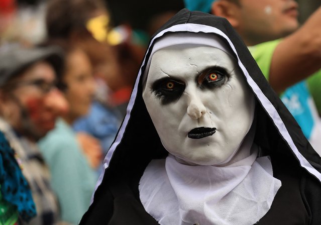 A reveller wearing a costume attends a costume parade as part of Halloween celebrations in Medellin, Colombia on October 29, 2024. (Photo by Jaime Saldarriaga/AFP Photo)