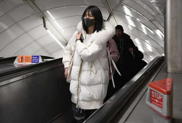 A women wearing a face mask at Leicester Square tube station in London on February 28, 2020, as the first case of coronavirus has been confirmed in Wales and two more were identified in England - bringing the total number in the UK to 19. (Photo by Kirsty O'Connor/PA Images via Getty Images)