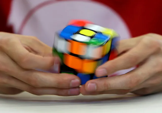 A competitor solves a Rubik's cube during the Rubik's Cube European Championship in Prague, Czech Republic, July 15, 2016. (Photo by David W. Cerny/Reuters)