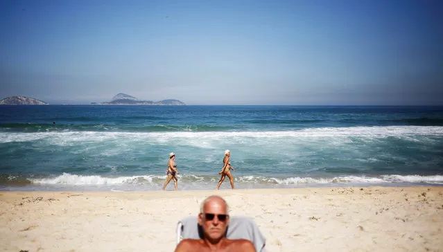 A man sunbathes on Ipanema beach in Rio de Janeiro, Brazil, May 3, 2016. (Photo by Nacho Doce/Reuters)