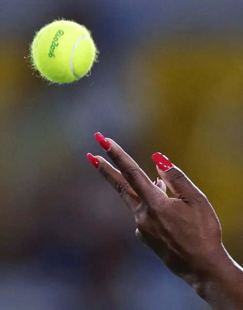 Serena Williams, of the United States, toss the ball on a serve to Elina Svitolina, of Urkaine, at the 2016 Summer Olympics in Rio de Janeiro, Brazil, Tuesday, August 9, 2016. (Photo by Charles Krupa/AP Photo)