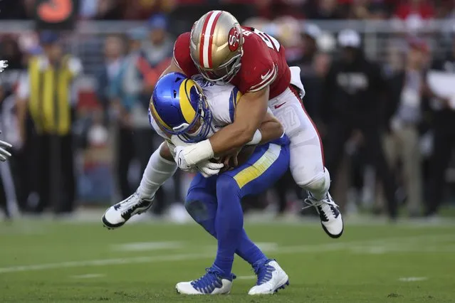 San Francisco 49ers defensive end Nick Bosa, top, sacks Los Angeles Rams quarterback Matthew Stafford during the first half of an NFL football game in Santa Clara, Calif., Monday, October 3, 2022. (Photo by Jed Jacobsohn/AP Photo)