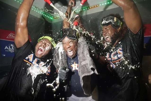 Houston Astros manager Dusty Baker Jr., center, celebrates with pitcher Hector Neris, left, and pitcher Cristian Javier, right, after defeating the Seattle Mariners in Game 3 of an American League Division Series baseball game Saturday, October 15, 2022, in Seattle. (Photo by Abbie Parr/AP Photo)