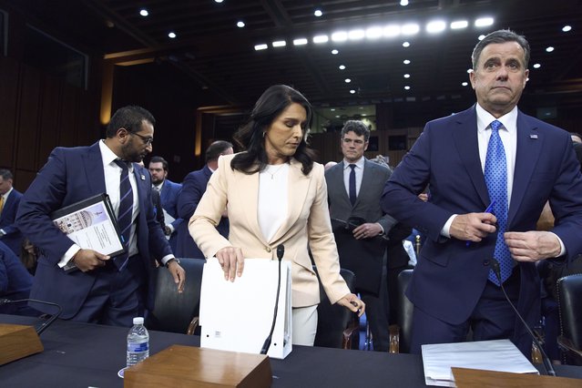 Director of National Intelligence Tulsi Gabbard, center, is flanked by FBI Director Kash Patel, left, and CIA Director John Ratcliffe, as the Senate Intelligence Committee holds its worldwide threats hearing, on Capitol Hill in Washington, Tuesday, March 25, 2025. (Photo by J. Scott Applewhite/AP Photo)