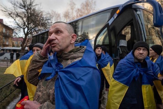 Ukrainian servicemen react after they were released by Russia as part of an expected prisoner swap on Wednesday, March 19, 2025. There were 175 servicemen exchanged on each side, the Russian Defense Ministry said. (Photo by Efrem Lukatsky/AP Photo)