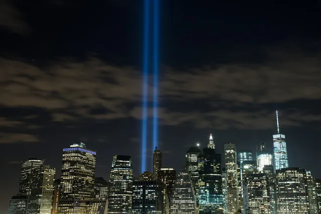 The “Tribute in Light” rises from the Lower Manhattan skyline as seen from the Brooklyn Heights Promenade, September 7, 2016 in the Brooklyn borough of New York City. The lights were being tested in advance of the 15th anniversary of the September 11 terrorist attacks. (Photo by Drew Angerer/Getty Images)