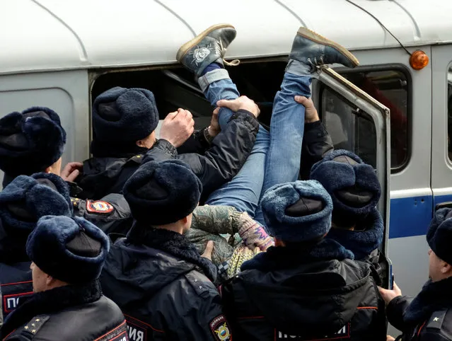 Police officers detain an opposition supporter during a rally in Vladivostok, Russia, March 26, 2017. (Photo by Yuri Maltsev/Reuters)