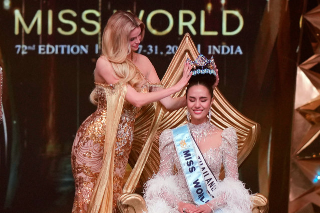 Krystyna Pyszkova of Czech Republic, left, crowns her successor Opal Suchata of Thailand after she who won the 72nd Miss World pageant in Hyderabad, India, Saturday, May 31, 2025. (Photo by Mahesh Kumar A./AP Photo)