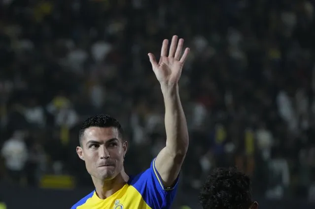 Cristiano Ronaldo greets Saudi fans during his official unveiling as a new member of Al Nassr soccer club in in Riyadh, Saudi Arabia, Tuesday, January 3, 2023. Ronaldo, who has won five Ballon d'Ors awards for the best soccer player in the world and five Champions League titles, will play outside of Europe for the first time in his storied career. (Photo by Amr Nabil/AP Photo)