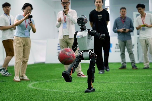 A K1 robot from Booster Robotics operates before leaving for the Brazil Robocup at a pre-competition exploration camp in Beijing, Wednesday, July 9, 2025. (Photo by Mahesh Kumar A./AP Photo)