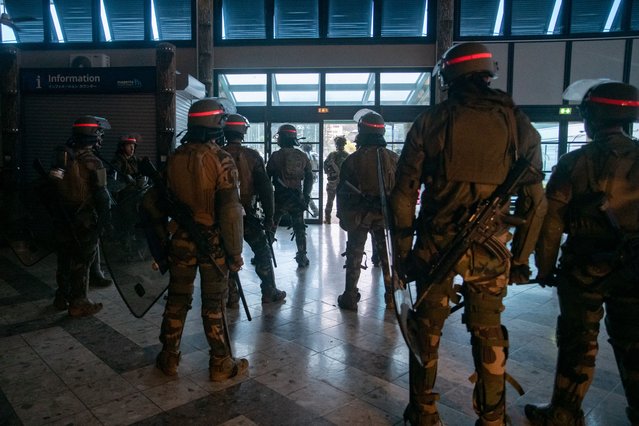 French soldiers of the 8th Marine Infantry Regiment (8e RIMa) secure the Magenta airport in Noumea, France's Pacific territory of New Caledonia, on May 17, 2024. France deployed troops to New Caledonia's ports and international airport, banned TikTok and imposed a state of emergency on May 16 after three nights of clashes that have left four dead and hundreds wounded. Pro-independence, largely indigenous protests against a French plan to impose new voting rules on its Pacific archipelago have spiralled into the deadliest violence since the 1980s, with a police officer among several killed by gunfire. (Photo by Delphine Mayeur/AFP Photo)