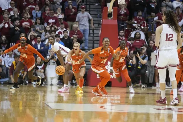 Miami's Jasmyne Roberts (4) and Haley Cavinder (14) react after Miami defeated Indiana in a second-round college basketball game in the women's NCAA Tournament Monday, March 20, 2023, in Bloomington, Ind. (Photo by Darron Cummings/AP Photo)