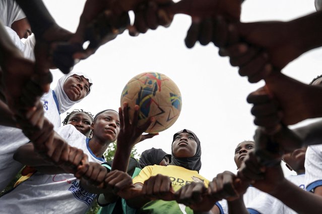 Model Queens Football Academy team players Salaudeen Ganiyah, 16, Joseph Hanna, 18, and Lawal Hikmat 18, prepare for the Youth Tournament final match with Kwara Ladies FC in Ilorin, Kwara State, Nigeria, on August 29, 2025. In central Nigeria's Muslim-majority state of Kwara, where religious traditions shape daily life, a group of girls are challenging cultural norms by playing soccer. (Photo by Sodiq Adelakun/Reuters)