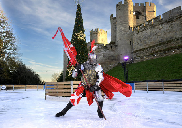 Figure skater Jacob Casey, dressed as a knight in full armour, performs on the ice rink at Warwick Castle in UK with one month to go until Christmas on Tuesday, November 25, 2025. (Photo by Doug Peters/PA Media Assignments)