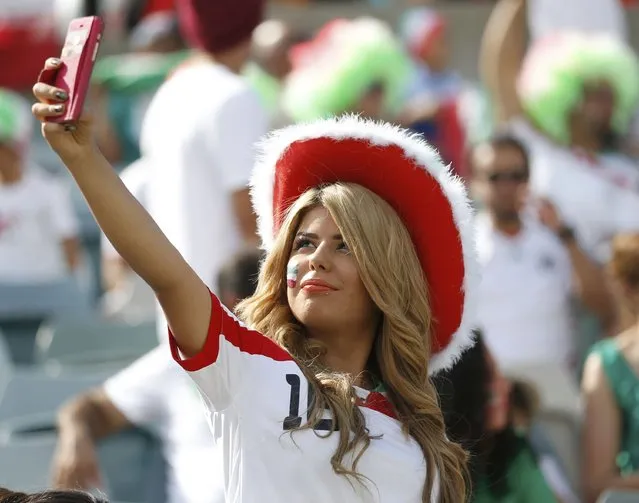 An Iran fan takes a selfie photo before the Asian Cup quarter-final soccer match between Iran and Iraq at the Canberra stadium in Canberra January 23, 2015. (Photo by Tim Wimborne/Reuters)