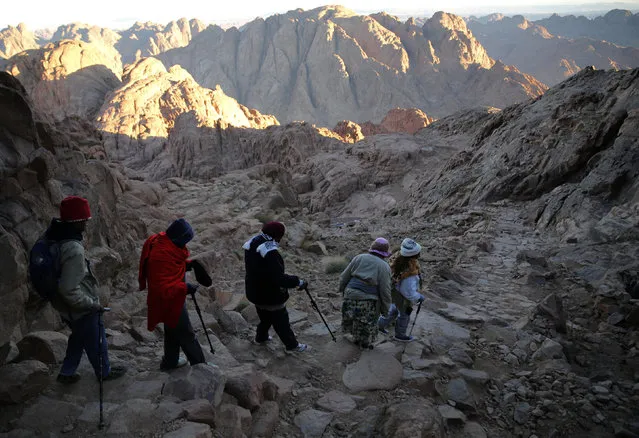 Tourists and worshippers make their way down from the summit of Mount Moses, near the city of Saint Catherine, in the Sinai Peninsula, south of Egypt, December 9, 2015. (Photo by Amr Abdallah Dalsh/Reuters)