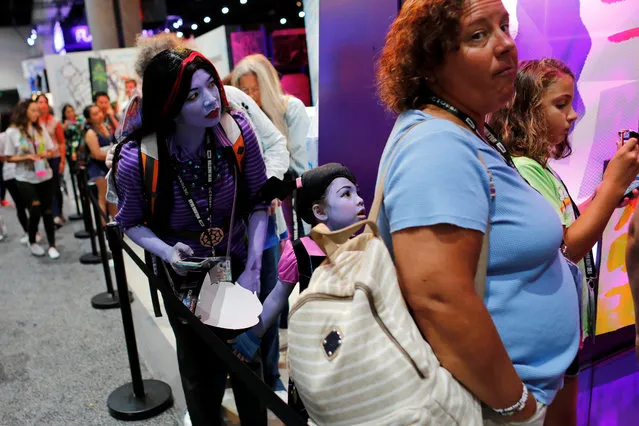 Attendees Monica Davis and her daughter Eleanor wait in line during preview night before the opening of pop culture convention Comic Con International in San Diego, USA on Thursday, July 19, 2018. (Photo by Mike Blake/Reuters)