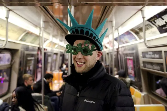 Maxence Fombaron of Paris, France poses for a photo as he rides the subway to the New Year celebrations in Times Square in the Manhattan borough of New York December 31, 2015. (Photo by Andrew Kelly/Reuters)