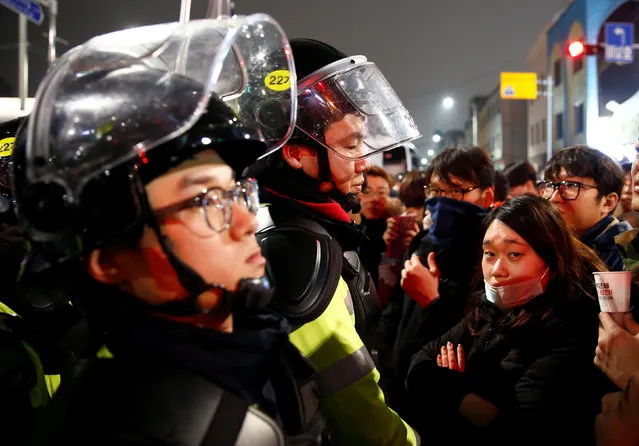 Riot policemen stand to block protesters at a protest calling South Korean President Park Geun-hye to step down in Seoul, South Korea, November 26, 2016. (Photo by Kim Kyung-Hoon/Reuters)