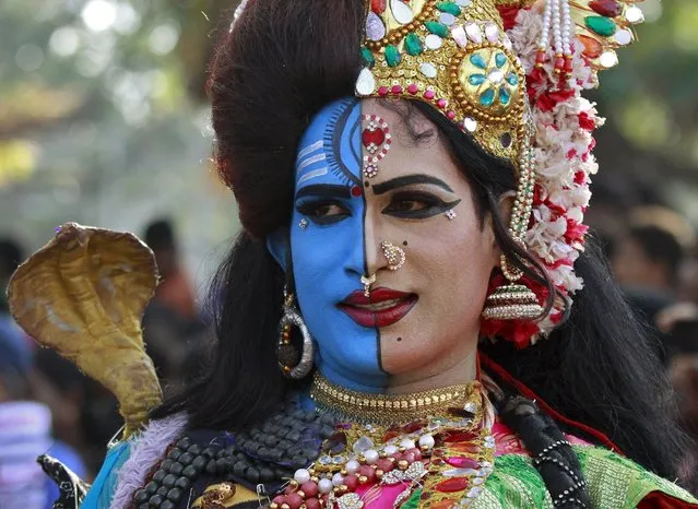 A man dressed as Hindu God Ardhnarishwar, takes part in the 32nd Cochin Carnival at Fort Kochi in Kerala, India, January 1, 2016. The Carnival is held annually to welcome the start of the New Year. (Photo by Sivaram V/Reuters)