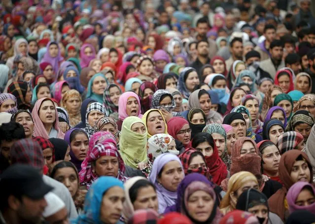 Kashmiri women attend the funeral prayers of Sajad Ahmad Bhat, a suspected militant, on the outskirts of Srinagar, January 12, 2016. (Photo by Danish Ismail/Reuters)