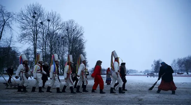 Belarussian villagers perform during a celebration of the "Tsary" rite in the village of Semezhevo, Belarus January 13, 2016. This unique rite originated from the 18th century, and now takes place only in this village marking the New Year, according to the Julian calendar, on January 13. (Photo by Vasily Fedosenko/Reuters)