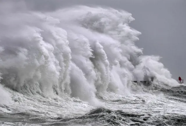 This photograph taken in Plobannalec-Lesconil, western France, on March 23, 2023 shows strong winds and high waves hitting the coast. (Photo by Fred Tanneau/AFP Photo)
