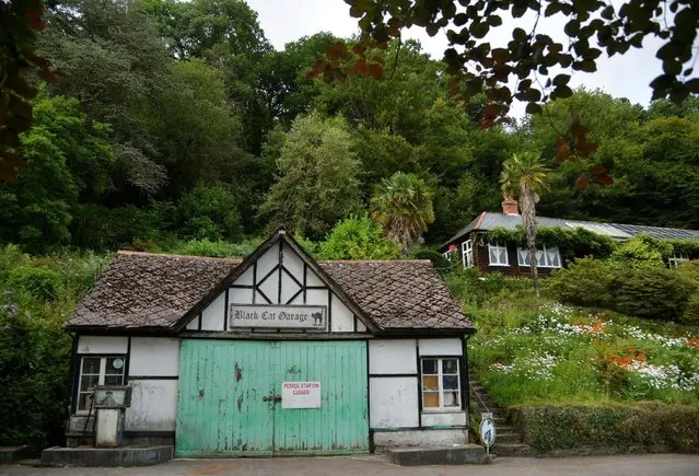 The Black Cat Garage, which has been shut for over a decade, is seen on a minor road near Tiverton in Devon, Britain, July 29, 2016. (Photo by Toby Melville/Reuters)