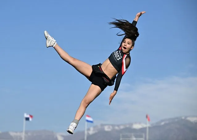 A cheerleader jumps for joy before the start of the Pan-Am Games in Santiago, Chile on October 31, 2023. Thousands of athletes from across the Americas are competing before the Paris Games next year. The International Olympic Committee recognised cheerleading as an Olympic sport in 2021. (Photo by Dylan Martinez/Reuters)