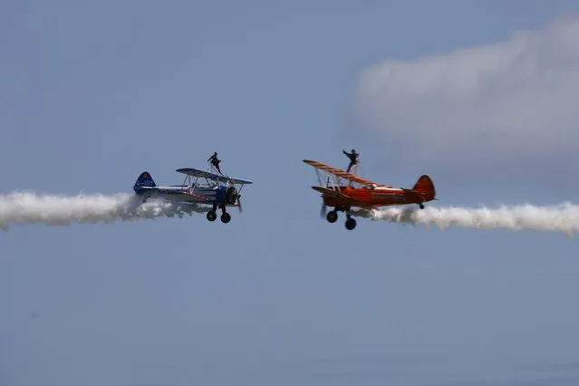 Aerosupabatics wingwalkers entertain the crowds in Eastbourne, United Kingdom on August 20, 2022. Today see's the 3rd day of the Eastbourne airshow with aircraft flying their displays over the sea. (Photo by Ed Brown/Alamy Live News)