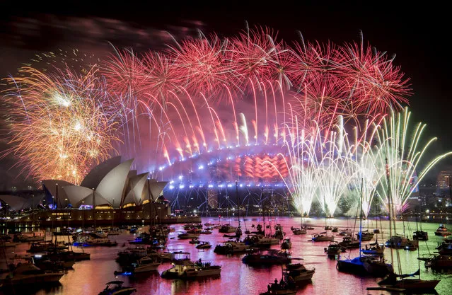 Fireworks explode over the Sydney Harbour during New Year's Eve celebrations in Sydney, Tuesday, January 1, 2019. (Photo by Brendan Esposito/AAP via AP Photo)