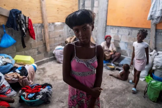 A girl looks at the camera inside a shelter for families displaced by gang violence at the Saint Yves Church in Port-au-Prince, Haiti on July 26, 2021. (Photo by Ricardo Arduengo/Reuters)
