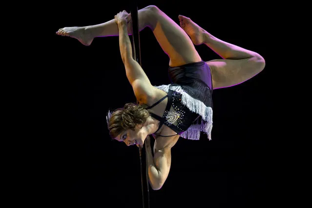 United Kingdom's Charlotte Robertson competes during the 2015 World Pole Dance Championships held in Beijing, Sunday, April 12, 2015. (Photo by Ng Han Guan/AP Photo)