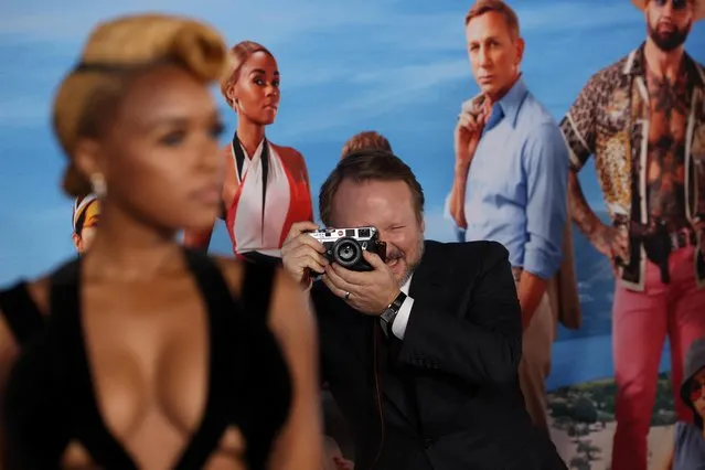 Director Rian Johnson takes a photo of cast member Janelle Monae at the premiere for the film Glass Onion: A Knives Out Mystery at the Academy Museum of Motion Pictures in Los Angeles, California, U.S., November 14, 2022. (Photo by Mario Anzuoni/Reuters)