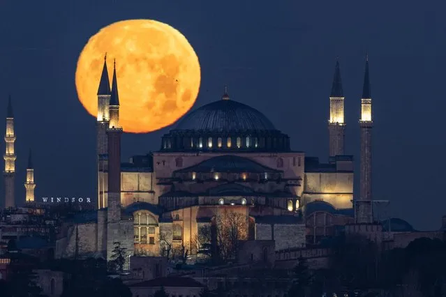 Full moon rises over Hagia Sophia Grand Mosque in Istanbul, Turkiye on December 26, 2023. (Photo by Cemal Yurttas/Anadolu via Getty Images)