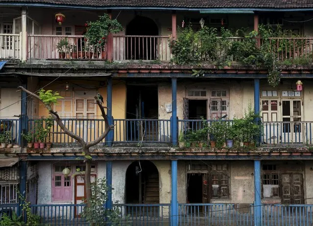 Windows and doors of an old residential building are pictured in central Mumbai October 10, 2014. The cost for buying a residential apartment in Mumbai close to the city centre ranges from 12,000 Indian rupees ($ 200) per square feet to 112,552 Indian rupees ($ 1800) per square feet. (Photo by Danish Siddiqui/Reuters)