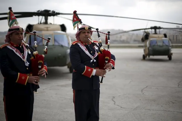 Members of a Jordanian police band perform during a handover ceremony held to deliver Black Hawk helicopters to Jordan from the U.S. government at Amman military airport, Jordan, March 3, 2016. (Photo by Muhammad Hamed/Reuters)