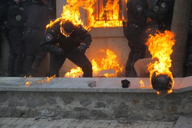 This handout photo released by Ukrainian Ministry of Internal Affairs shows burning members of the Ukrainian riot police due to the gasoline bombs hurled by anti-government protestors during the clashes in central Kiev, Ukraine, January 20, 2014.(Photo by Ukrainian Ministry of Internal Affairs/Anadolu Agency/Getty Images)
