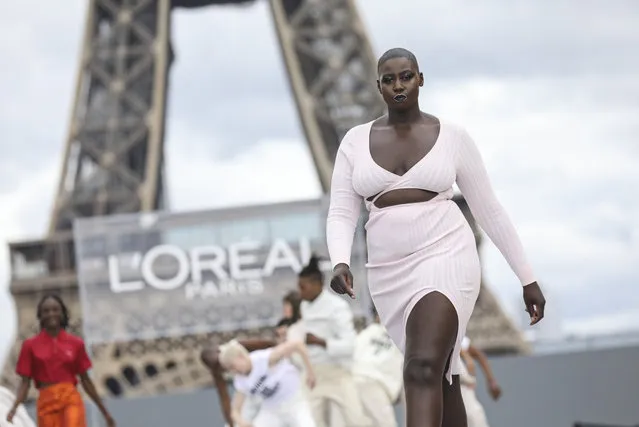 A model wears a creation for the L'Oreal Spring-Summer 2022 ready-to-wear fashion show presented in Paris, Sunday, October 3, 2021. (Photo by Vianney Le Caer/Invision/AP Photo)