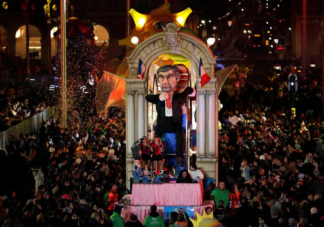 A float with a giant figure of Francois Fillon, former French prime minister, member of The Republicans political party and 2017 presidential candidate of the French centre-right is paraded through the crowd during the 133rd Carnival, the first major event since the city was attacked during Bastille Day celebrations last year in Nice, France, February 11, 2017. (Photo by Eric Gaillard/Reuters)