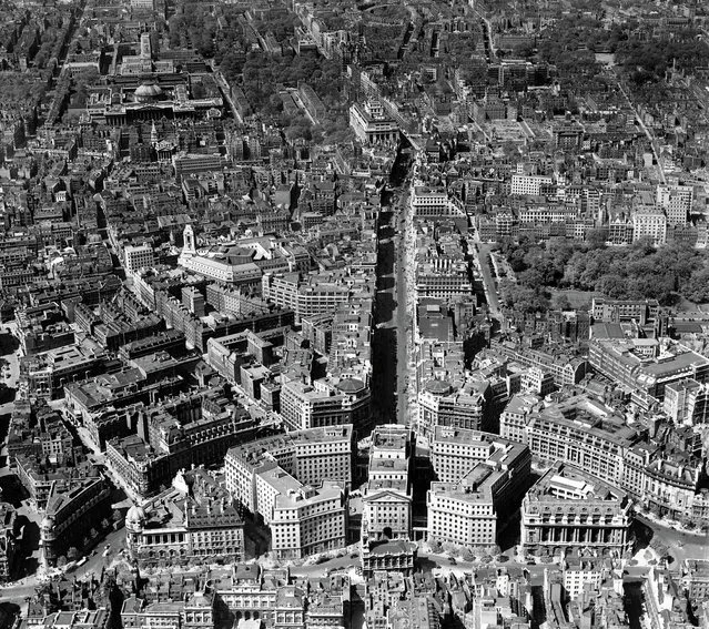 Bush House, Kingsway and the British Museum, Westminster, 1946 With the grand façade of the British Museum just visible in the top left, the central London transport artery of the Kingsway is picked out here in strong shadow running down to the monolithic Bush House office complex. When first opened in July 1925  at a construction cost of £2 million. 1946. (Photo by Aerofilms Collection via “A History of Britain From Above”)