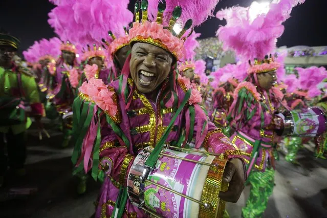 Performers from the Mangueira samba school parade during carnival celebrations at the Sambadrome in Rio de Janeiro, Brazil, Monday, March 3, 2014. (Photo by Nelson Antoine/AP Photo)