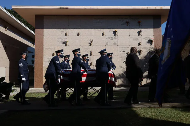 Air Force Honor Guard members carry the American flag draped casket of former U.S. Rep. Carrie Meek (D-FL) to the internment service at the Caballero Rivero Dade North Memorial Park on December 07, 2021 in Miami, Florida. Meek, who died on November 28 at age 95, became one of the first Black lawmakers from Florida to serve in Congress since the post-Civil War Reconstruction. (Photo by Joe Raedle/Getty Images)
