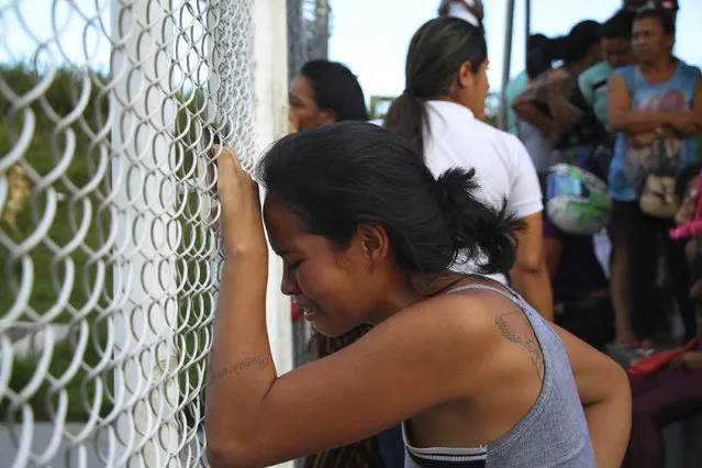 A relative of a prisoner cries outside the Anisio Jobim Prison Complex in Manaus, Amazonas state, Brazil, Monday, May 27, 2019. Brazilian authorities said 42 inmates were killed at three different prisons in the capital of the northern state of Amazonas, a day after 15 prisoners died in a riot at a fourth prison in the city. (Photo by Edmar Barros/AP Photo)