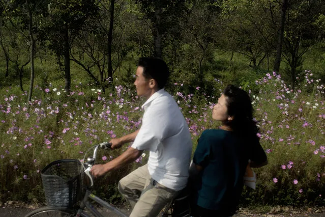 A young couple on the way to Kumsusan Palace. Kim Jong Il died in December, 2011. The North Korean news agency reported that an earthquake shook Mount Paeku where the Dear Leader was born while crying owls flew into the mausoleum. (Photo by Peter Hove Olesen)
