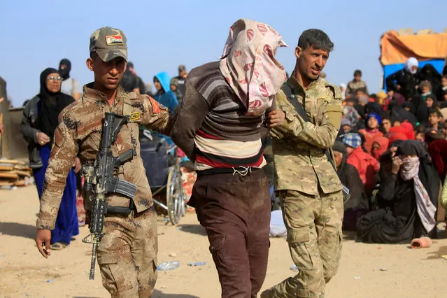 Iraqi Special Operations Forces arrest a person suspected of belonging to Islamic State militants in western Mosul, Iraq February 26, 2017. Picture taken February 26, 2017. (Photo by Alaa Al-Marjani/Reuters)