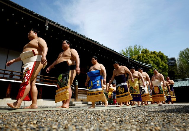 Sumo wrestlers take part in a Shinto ritual before the start of an annual sumo tournament dedicated to the Yasukuni Shrine in Tokyo, Japan on April 15, 2024. (Photo by Issei Kato/Reuters)