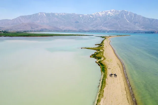 A drone photo shows that mounted units, which assigned to Van Provincial Gendarmerie Command from Gendarmerie Horse and Dog Training Center (JAKEM), support security forces for maintaining security along the Edremit coast of the Lake Van, where motor vehicles can not enter, on June 27, 2019 in Van, Turkey. (Photo by Ozkan Bilgin/Anadolu Agency/Getty Images)